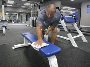 Time to get fit again. Luis Mendez, owner of True Fitness in Windsor, sanitizes equipment at the Tecumseh Road East location on Friday, July 9, 2021.