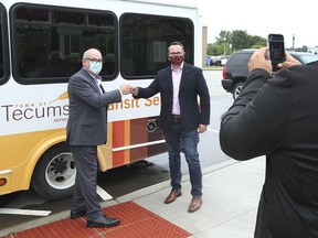 Tecumseh Mayor Gary McNamara, left, and MP Irek Kusmierczyk are shown at a press conference in Tecumseh on Friday, July 23, 2021. Kusmierczyk announced $27,150 in federal funding to the town to support an on-demand transit service.