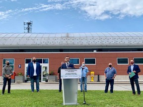 Canada's minister of transportation Omar Alghabra speaks to media outside the VIA Rail train station in Windsor on July 22, 2021. Windsor-Tecumseh MP Irek Kusmierczyk and Unifor Local 444 members stand in the background.