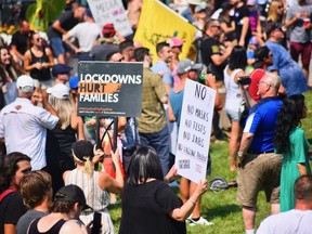 Hundreds gathered along Windsor's riverfront near the Great Canadian Flag on Saturday, Aug. 28, 2021 for a "freedom rally" and protest against what they termed "medical tyranny." Several people spoke, including local anti-lockdown activist Currie Soulliere and Chris Sky, who gained notoriety during the COVID-19 pandemic for his stance against masks, vaccines and lowdowns. (Kathleen Saylors/Windsor Star)