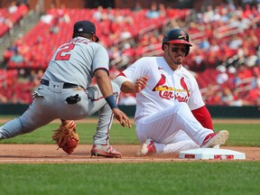 Nolan Arenado slides safely into third base Luis Arraez of the Minnesota Twins in the seventh inning at Busch Stadium on August 1, 2021 in St Louis, Missouri.
