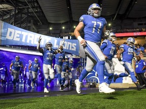 The Detroit Lions enter the field before a preseason game against the Buffalo Bills at Ford Field on August 13, 2021 in Detroit, Michigan.