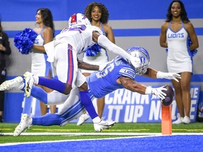 Rachad Wildgoose of the Buffalo Bills tackles Craig Reynolds of the Detroit Lions into the end zone during the fourth quarter of a preseason game at Ford Field on August 13, 2021 in Detroit, Michigan.