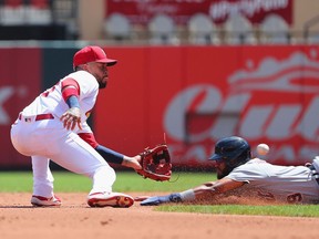 Willi Castro of the Detroit Tigers is caught stealing second base against Edmundo Sosa of the St. Louis Cardinals in the second inning at Busch Stadium on August 25, 2021 in St Louis, Missouri.