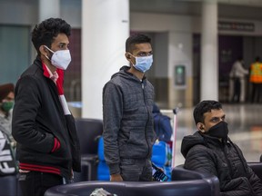 Students from India at the International Arrivals at Terminal 1 at Toronto Pearson International Airport are pictured in this file photo taken on Dec. 27, 2020.