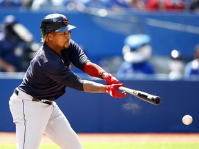 Jose Ramirez of the Cleveland Indians singles against the Toronto Blue Jays at Rogers Centre on August 2, 2021 in Toronto.