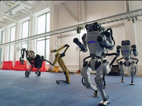 Spot, Handle and Atlas robots dance during a year-end video by the robotics company Boston Dynamics in a screen grab from a Dec. 29, 2020 social media post.