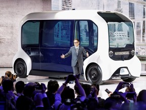 Toyota Motor Corporation President Akio Toyoda, shows the e-Palette autonomous concept vehicle at the Tokyo Motor Show, in Tokyo, Oct. 23, 2019.