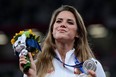 Silver medallist Poland's Maria Andrejczyk celebrates on the podium during the victory ceremony for the women's javelin throw event during the Tokyo 2020 Olympic Games at the Olympic Stadium in Tokyo on August 7, 2021.