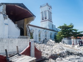 Rubble from a destroyed wall lies outside the Sacre coeur des Cayes church in Les Cayes on Aug. 15, 2021, after a 7.2-magnitude earthquake struck the southwest peninsula of the country.