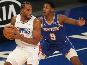 LA Clippers small forward Kawhi Leonard (2) controls the ball against New York Knicks shooting guard RJ Barrett (9) at Madison Square Garden