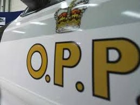 The OPP logo is seen on the side of a police vehicle in this undated file photo.