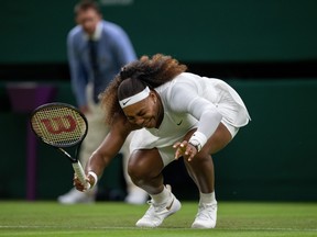 Serena Williams of the U.S. reacts after sustaining an injury before retiring from her first round match against Belarus' Aliaksandra Sasnovich at Wimbledon on June 29, 2021 at the All England Lawn Tennis and Croquet Club in London.