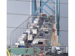 WINDSOR, ONTARIO. AUGUST 6, 2021 - Trucks heading into Canada at the Ambassador Bridge in Windsor are shown backed up the length of the bridge on Friday, August 6, 2021.