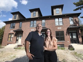 Walter and Michelle Branco of Noah Homes are shown on Tuesday, August 31, 2021 in front of the townhouses the company built in the 1200 block of Argyle Road in Windsor.