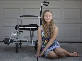 Devyn Nichols, 14, is pictured next to her wheelchair she was forced to use after being diagnosed with juvenile arthritis, on Tuesday, August 31, 2021.