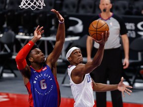 LA Clippers guard Rajon Rondo shoots on Detroit Pistons guard Hamidou Diallo in the second half at Little Caesars Arena.