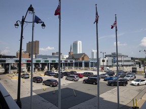 Vehicles line up to enter Canada at the Detroit-Windsor Tunnel on the first day American citizens who are double-vaccinated are allowed to enter Canada, on Monday, August 9, 2021.