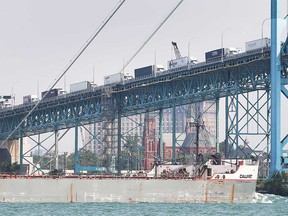 Transport trucks line the Ambassador Bridge on Aug. 6, 2021.