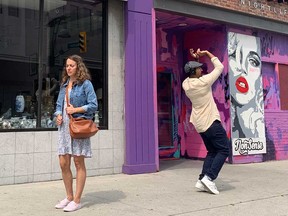 Meaghen Quinn (left) and Nadeem Phillip (right) perform in a CONTACT performance in downtown Windsor on August 11, 2021.