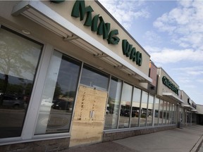A boarded-up front entrance to the Ming Wah Chinese Buffet on Tecumseh Road East is shown Tuesday, Aug. 3, 2021, after an early-morning fire.