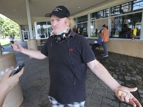 WINDSOR, ONTARIO. AUGUST 20, 2021 -  Patrick Grove is shown outside of the Windsor Water World on Friday, August 20, 2021 where the city runs day programs for the homeless. ItÕs been just a few days since he found housing.