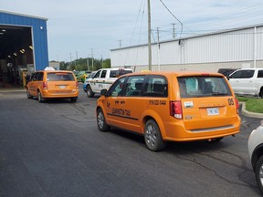 Leamington taxi vehicles are inspected by provincial Ministry of Transportation officers on Aug. 26, 2021.