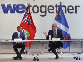Parm Gill (left), Ontario's Minister of Citizenship and Multiculturalism, speaks with Windsor Mayor Drew Dilkens at a roundtable discussion in Windsor on Aug. 19, 2021.