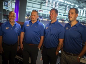 LaSalle's Andy Delmore, second from right, finally joined the Windsor Spitfires on Tuesday to join the staff with, from left, goalie coach Perry Wilson, head coach Marc Savard and associate coach Jerrod Smith.