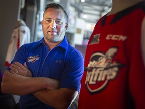 Marc Savard is stepping down as head coach of the Windsor Spitfires on Friday to accept a position with the NHL's Calgary Flames.
