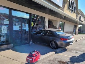 Essex County OPP said there were no injuries after a car crashed through the front window of a Lakeshore business Sunday morning.