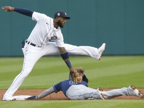 Taylor Walls of the Tampa Bay Rays beats the tag from Niko Goodrum of the Detroit Tigers to steal second base during the second inning at Comerica Park on September 11, 2021, in Detroit, Michigan.