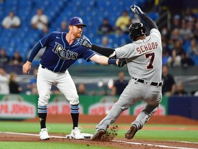 Jordan Luplow of the Tampa Bay Rays tags Jonathan Schoop of the Detroit Tigers out in the first inning at Tropicana Field on September 16, 2021 in St Petersburg, Florida.