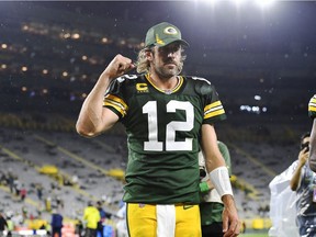 Aaron Rodgers #12 of the Green Bay Packers reacts as he walks of the field following the team's win against the Detroit Lions during an NFL football game at Lambeau Field on September 20, 2021 in Green Bay, Wisconsin.