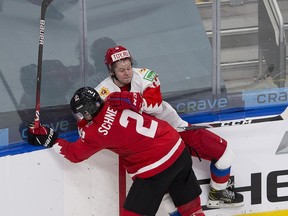 Canada's Braden Schneider (2) and Russia's Mikhail Abramov (back) battle during the world junior championship in January 2021 in Edmonton. Abramov was a fourth-round pick of the Maple Leafs in 2019.