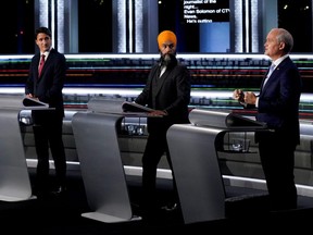 From left to right, Liberal Leader Justin Trudeau, NDP Leader Jagmeet Singh, and Conservative Leader Erin O'Toole take part in the federal election English-language Leaders debate in Gatineau, Que., Sept. 9, 2021.