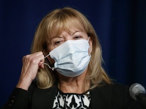 Ontario Minister of Health Christine Elliott removes her mask to speak at a press conference at Queen's Park in Toronto, Wednesday, Sept. 22, 2021.