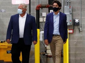 Premier Doug Ford (left) and Prime Minister Justin Trudeau are pictured on Aug. 21, 2020 when they announced a 3M plant in Brockville would be making N95 masks.