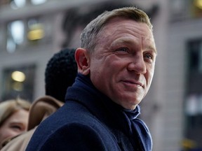 Actor Daniel Craig reacts during a promotional appearance on TV in Times Square for the new James Bond movie "No Time to Die" in the Manhattan borough of New York City, Dec. 4, 2019.