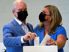 Canada's opposition Conservative Party leader Erin O'Toole and his wife Rebecca cast their ballots for the federal election, in Bowmanville, Ont., Sept. 20, 2021.