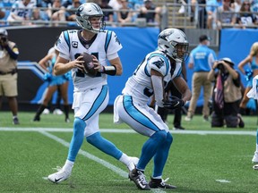 Carolina Panthers quarterback Sam Darnold back to pass with Canadian running back Chuba Hubbard blocking against the New Orleans Saints.