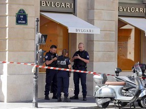 French Nationale Police officers form a security cordon on the Place Vendome square in Paris, on September 7, 2021, after a suspected heist in the French capital.