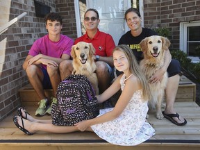 Brinton and Tina Sharman and their children Rhys, 15, Leora, 12, and family dogs Tanner and Esther are shown at their Amherstburg home on Thursday, September 2, 2021. The family is looking forward to in class learning when school starts next week.