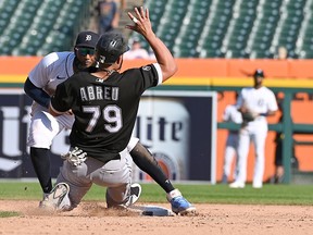 Detrot Tigers shortstop Niko Goodrum tags Chicago White Sox baserunner Jose Abreu while stealing second base and causes a ninth-inning bench clearing brawl at Comerica Park. Mandatory Credit: Dale Young-USA TODAY Sports