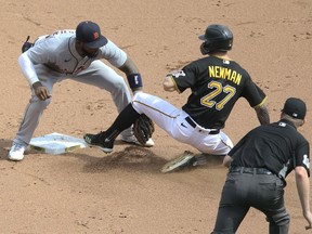 Detroit Tigers shortstop Niko Goodrum tags Pittsburgh Pirates shortstop Kevin Newman out at second base on the back-end of a double play during the fifth inning at PNC Park.