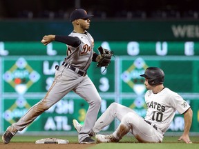 Detroit Tigers shortstop Harold Castro throws to first base after forcing Pittsburgh Pirates center fielder Bryan Reynolds at second base during the sixth inning at PNC Park.