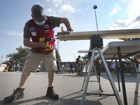 Jeremiah Bettany works on a section of a bed during the Sleep In Heavenly Peace organization's fabricating event on Saturday, Sept. 11, 2021 at the east Windsor Lowe's store.