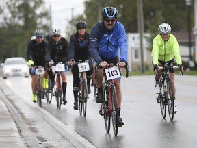 A group of cyclists heads out for a ride on Saturday, Sept. 25, 2021, during the Essex Region Conservation Bike Tour event in Kingsville.