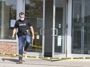 A LaSalle police officer is shown at the CIBC bank in LaSalle on Saturday, September 18, 2021. The branch was robbed at approximately 10 a.m.