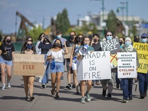 Climate activists demonstrate along the river to demand more be done on climate change as we head towards a federal election, Wednesday, September 8, 2021.